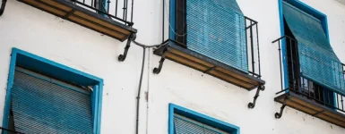 depositphotos_381846410-stock-photo-blue-white-closed-window-blinds