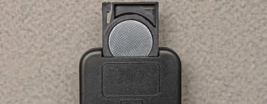 depositphotos_460226486-stock-photo-one-white-metal-battery-black